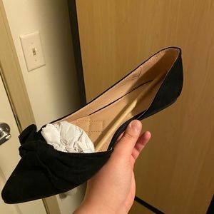 Women’s black velvet flats.